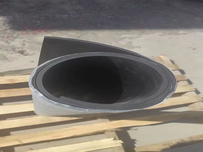 Person lifting weights on rubber floor